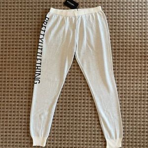 White pretty little thing joggers with black lettering down side